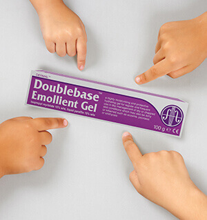 children's hands pointing to a pack of Doublebase